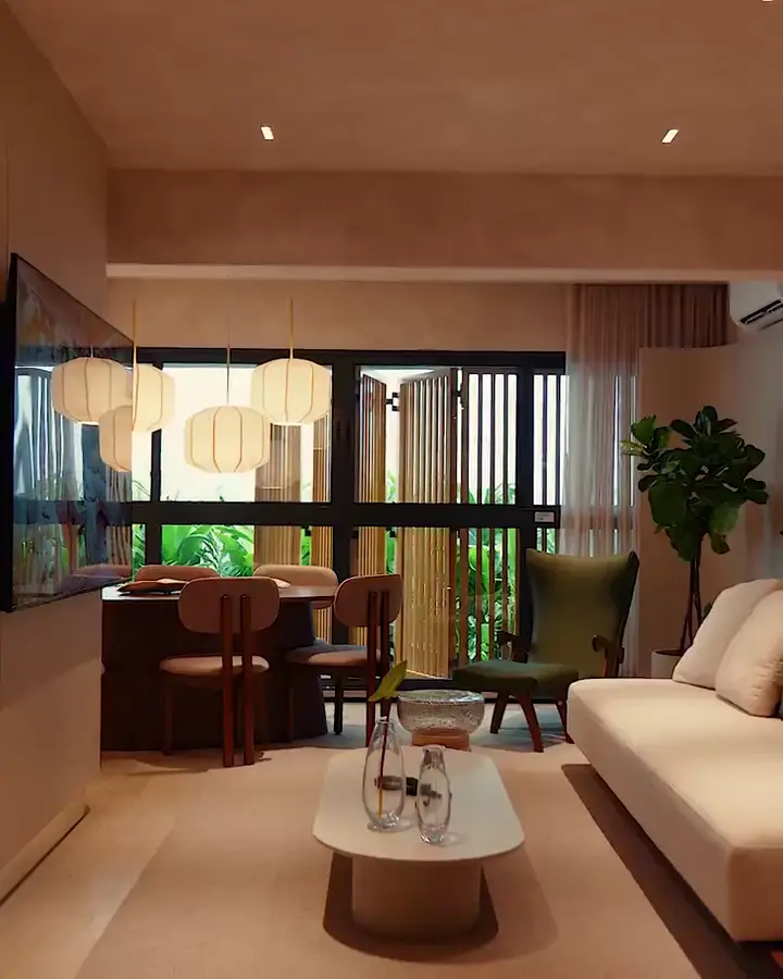Sala de estar do apartamento decorado, com sofá claro e luz quente.